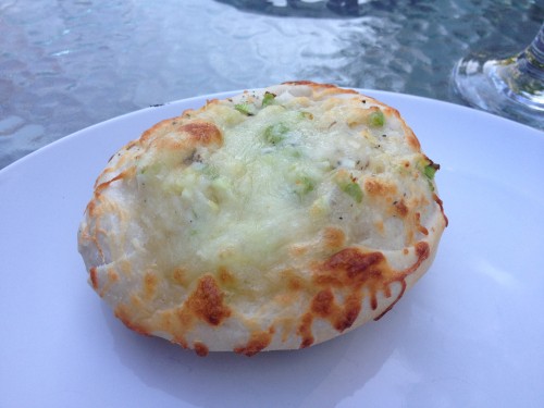 An appetizer round of garlic and green onion cheese bread using the same dough as the pizza crust.