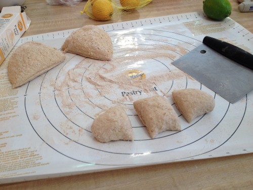 Cutting the dough ball into each of the bagels.