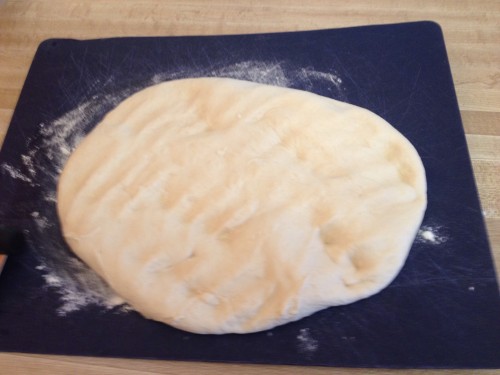 Punching down the dough removes air bubbles, getting it ready to make loves and proof the dough.