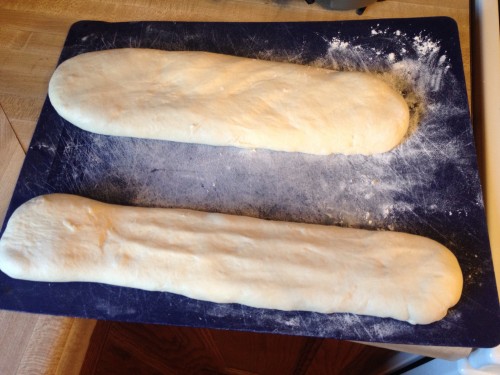 Proof the bread loaves on a floured surface.
