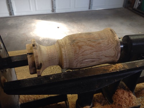 Showing the texture and details being added to the wooden water goblet as it takes shape on the wood late.