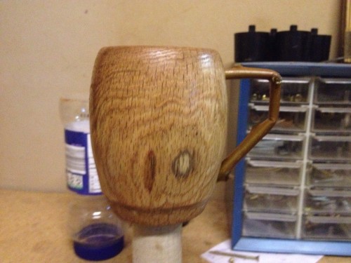 The finished oak coffee mug with a sumac branch handle.