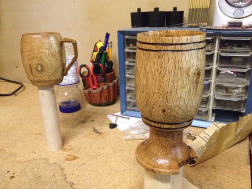 Finished wood lathe projects - an oak water goblet and an oak coffee mug.