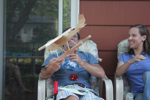 My father-in-law checking the details of his airplane whirligig.
