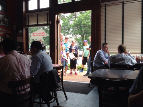 A line of patrons wait to enter at Bogarts Smokehouse