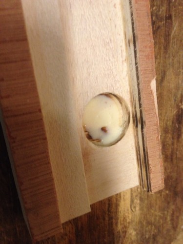 Glue the magnets into a recessed hole.
