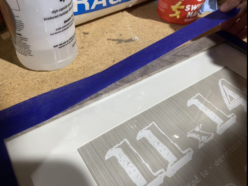 Lay masking tape on the face of the picture frame