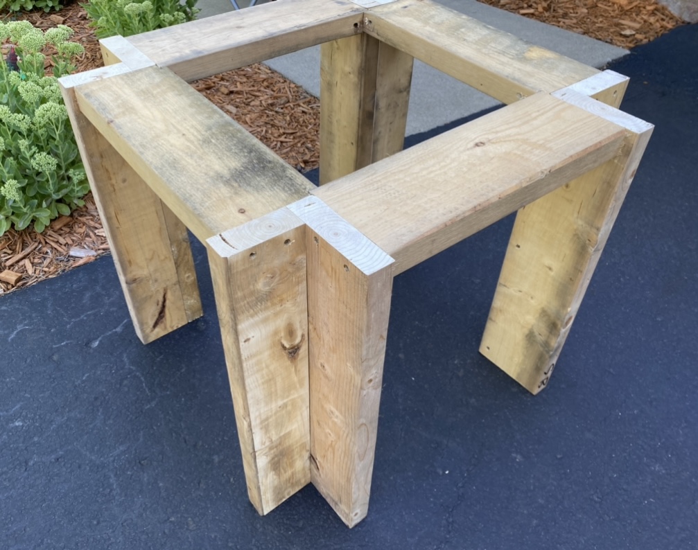 Table top supports attached to the legs side view