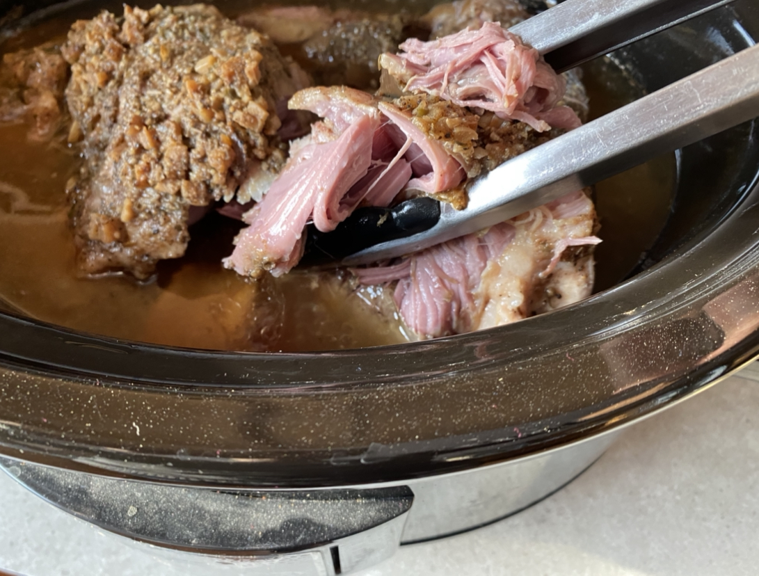 The pork shoulder tears apart easily with a tongs