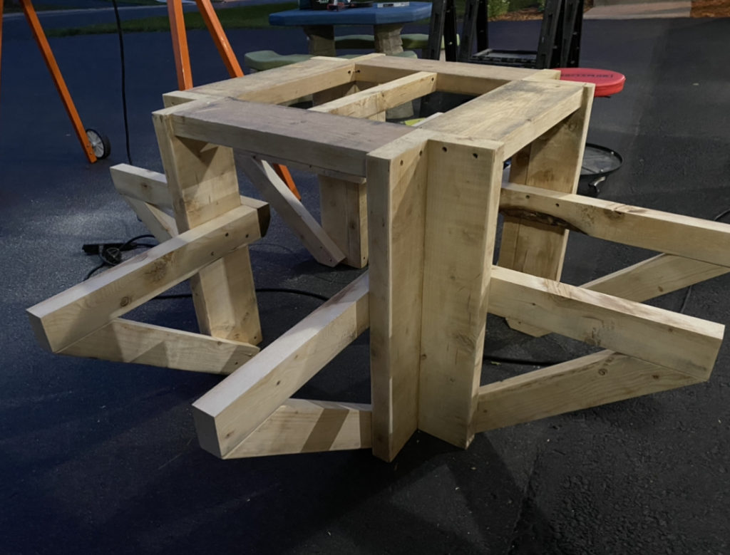 Bench seat supports are mounted to the picnic table.