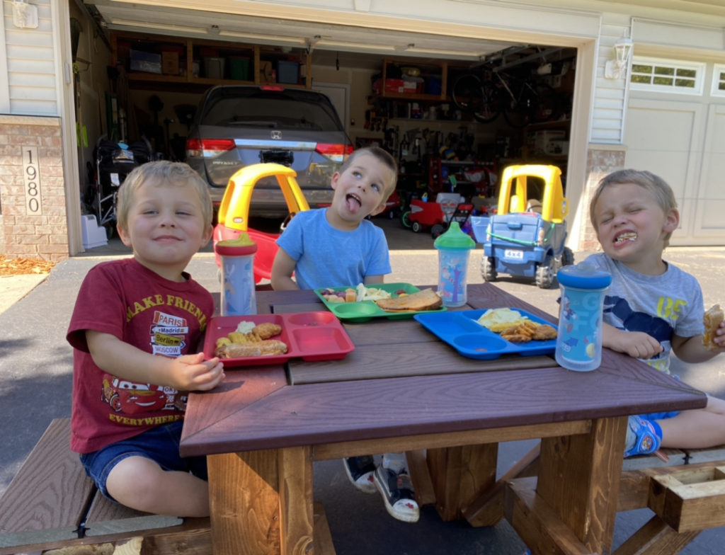 Kids enjoying the DIY square kids picnic table